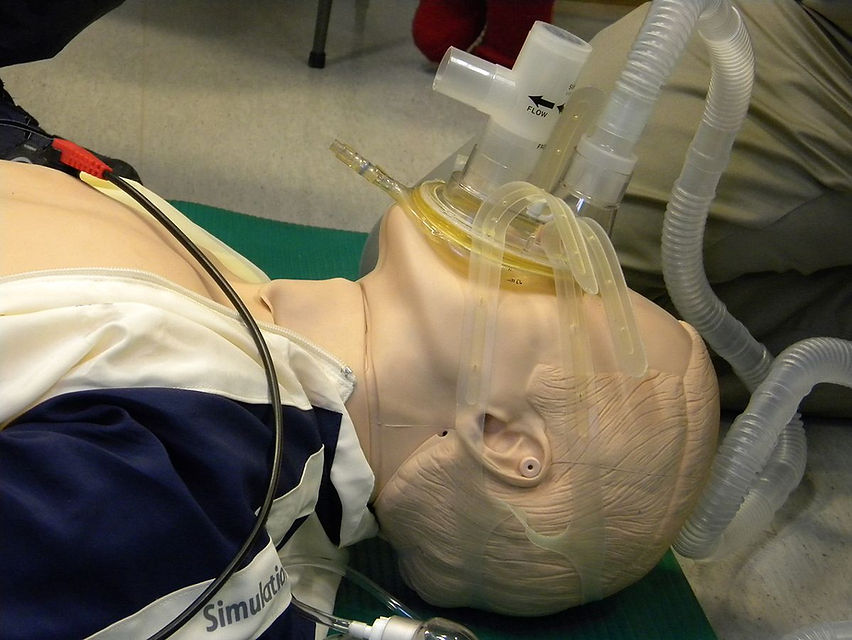 CPAP continuous positive airway pressure mask installed on a dummy patient for demonstrative purposes.