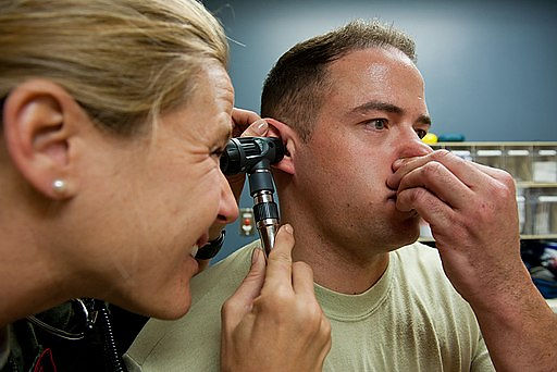 Capt. Sarah Freidel, 34th Bomb Squadron flight surgeon, performs a valsalva maneuver on Staff Sgt. Jacob Appleby, 28th Medical Operations Squadron ambulance services technician, during a physical exam in the flight medicine clinic on Ellsworth Air Force Base, S.D., May 2, 2012. During a valsalva maneuver, medical professionals watch closely as the patient exhales against a closed airway and evaluate how well the patient’s ear drum moves to better determine the patient’s ear health.